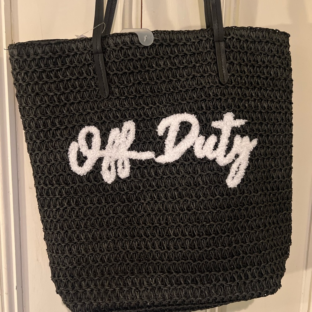 Adorable NWT “off duty” black straw beach bag or off shirt bag. Love this!!!